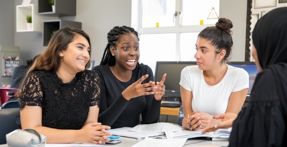 Image of 6th form students talking animatedly